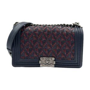This is an authentic CHANEL Calfskin Woven Medium Boy Flap in Blue and Burgundy.